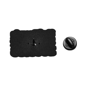 Detailed view of the back of a black enamel pin with a durable rubber clutch fastener