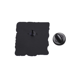 Detail view of the black metal brooch back with secure rubber clutch backing