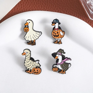 Set of four cute Halloween duck enamel pins featuring ghost and pumpkin designs