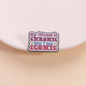 Colorful enamel brooch with My illness is CHRONIC but I am ICONIC slogan on pink plate