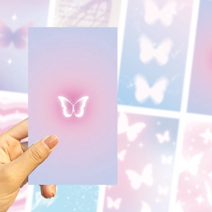 Detail of DIY phone card sticker with glowing butterfly on pink purple gradient