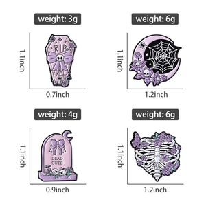 Detail view of purple gothic enamel pins with RIP coffin and skeleton designs