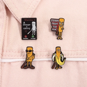 Macro shot of novelty enamel pins on pink denim, featuring a stranger calling design