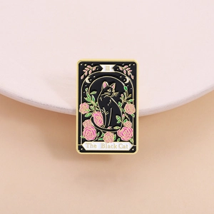 Macro detail of The Black Cat Tarot enamel pin with pink roses and golden metal edges