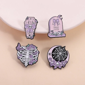 Set of 4 gothic Halloween enamel pins featuring purple coffin, tombstone and floral ribs