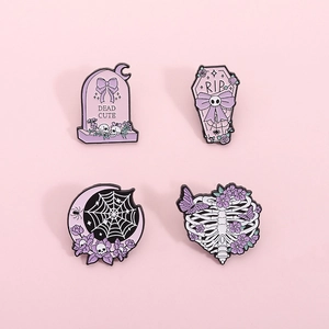 Set of 4 gothic Halloween enamel pins featuring purple coffins and gravestones