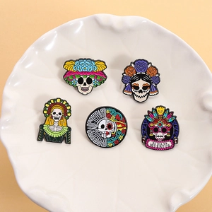 5-piece Dia de Muertos skull enamel pins set with colorful floral patterns and crowns