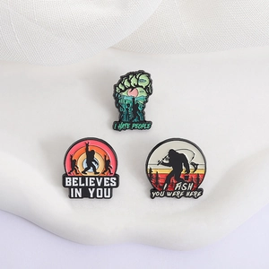 Set of three Bigfoot forest enamel pins with wilderness silhouettes for clothing