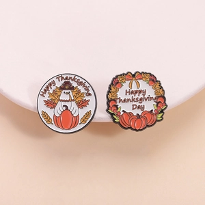 Set of two colorful Happy Thanksgiving enamel pins with pumpkin and pilgrim chicken designs