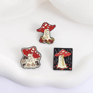 Three-piece set of cartoon ghost and mushroom enamel pins on a soft white background