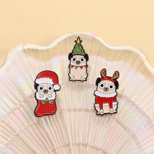Set of three cute cartoon pug enamel pins featuring Christmas hats and reindeer outfits