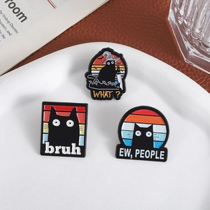 Three funny black cat enamel pins set including witch and knife cats on a ceramic tray