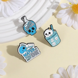 Blue aesthetic enamel pin set with skull potion bottle and Drink Water text badge