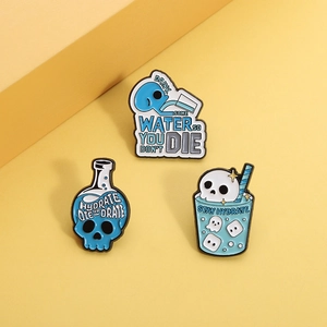 Three-piece skull theme enamel pins set with creative blue hydration slogans on yellow background