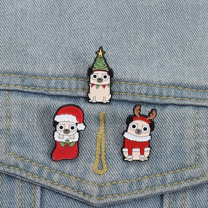 Close-up of pug enamel pins on denim jacket showing Christmas tree and reindeer designs