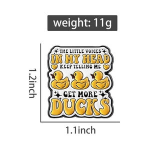 Detail view of funny little yellow duck enamel pin with 1.2 inch size dimensions