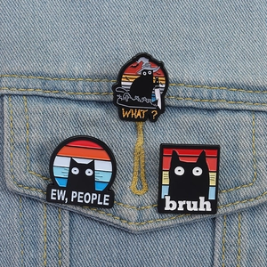 Funny black cat enamel pins set featuring humorous quotes on blue denim jacket