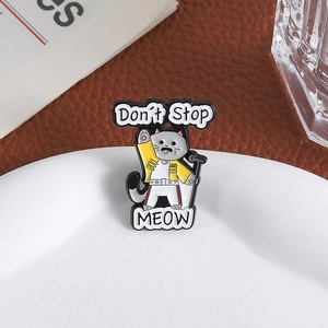 Freddie Mercury cat enamel pin with Don't Stop Meow text on white plate