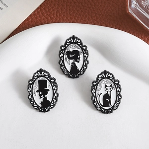 Gothic skull couple and black cat enamel pin set with Victorian frames and cobwebs