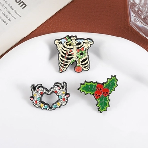Three-piece Christmas skeleton enamel pin set with holiday wreaths and festive lights