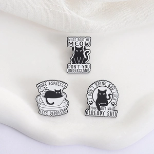 Set of three creative black cat enamel pins with humorous English quotes and cat motifs