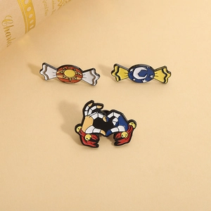 FNAF inspired enamel pins with Sun, Moon candy and skull hands heart shapes on beige background