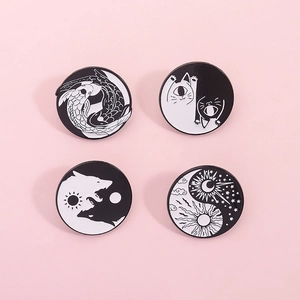 Yin Yang enamel pin set featuring koi fish, wolf, cat and moon sun designs on pink background