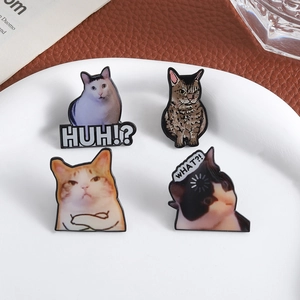 Close-up of four funny cat meme badges in a ceramic dish, featuring high-quality UV printing