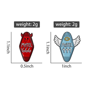 Detail view of devil 666 and angel 444 motel enamel pins with size and weight specs