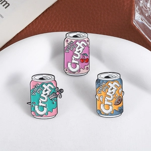 Three colorful enamel pins in soda can designs with creative You're my Crush text
