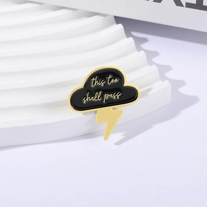 Cloud and lightning enamel brooch with 'this too shall pass' quote in gold finish