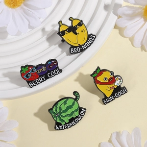 Set of 4 creative fruit enamel pins with funny banana, berry, mango, and cat designs