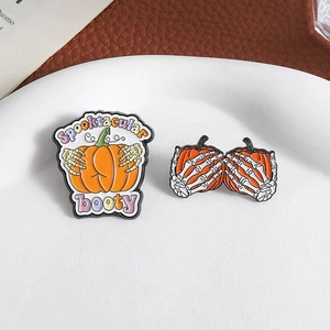 Halloween pumpkin skeleton hand enamel brooches with Spooktacular text design