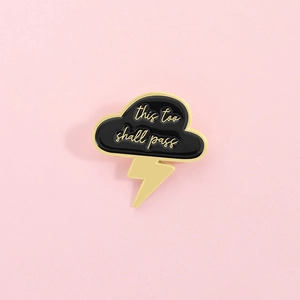 Minimalist cloud and lightning enamel pin with This Too Shall Pass inspirational quote