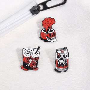 Detail of three punk skull drink enamel pins on a white canvas bag with Drunk Forever text