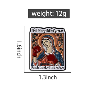 Detail of creative Virgin Mary enamel pin with boxing gloves including size and weight specs