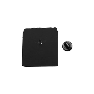 Macro shot of the black matte metal pin back and durable rubber clutch closure