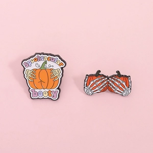 Halloween pumpkin enamel pin set with skeleton hand and Spooktacular booty text design