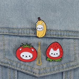 Funny cartoon cat fruit enamel pins featuring banana strawberry and tomato designs