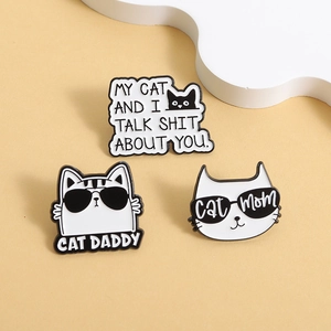 Funny black and white cat enamel pins with Cat Daddy and Cat Mom text for pet lovers