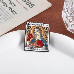 Funny Mary boxer enamel pin with red gloves and orange halo on a white plate