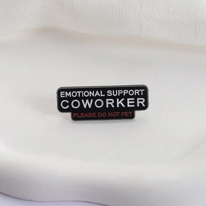 Black rectangular enamel pin brooch featuring Emotional Support Coworker text