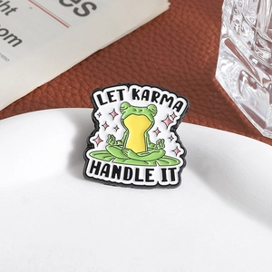 Funny yoga frog enamel pin on lily pad with Let Karma Handle It text for clothing