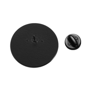 Detail of matte black metal pin base and rubber clutch fastener for star pattern badge