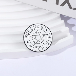 Minimalist Protected by Witchcraft enamel pin with pentagram on a white display