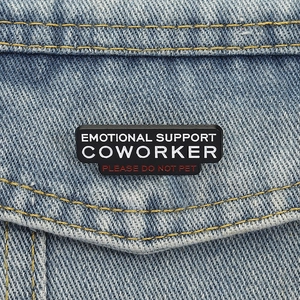 Emotional Support Coworker enamel pin on denim jacket with Please Do Not Pet text