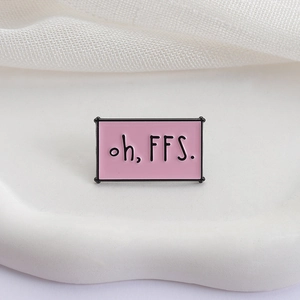 Pink enamel rectangle brooch pin with black oh, FFS. slogan on marble texture background