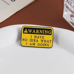 Funny Warning Sign Enamel Pin with I Have No Idea What I Am Doing slogan on white plate