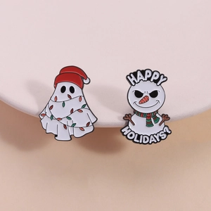Christmas enamel pins set featuring a festive ghost with lights and a funny snowman badge