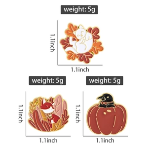 Detailed view of autumn enamel pins with fox, cat and crow designs, 1.1 inch size info